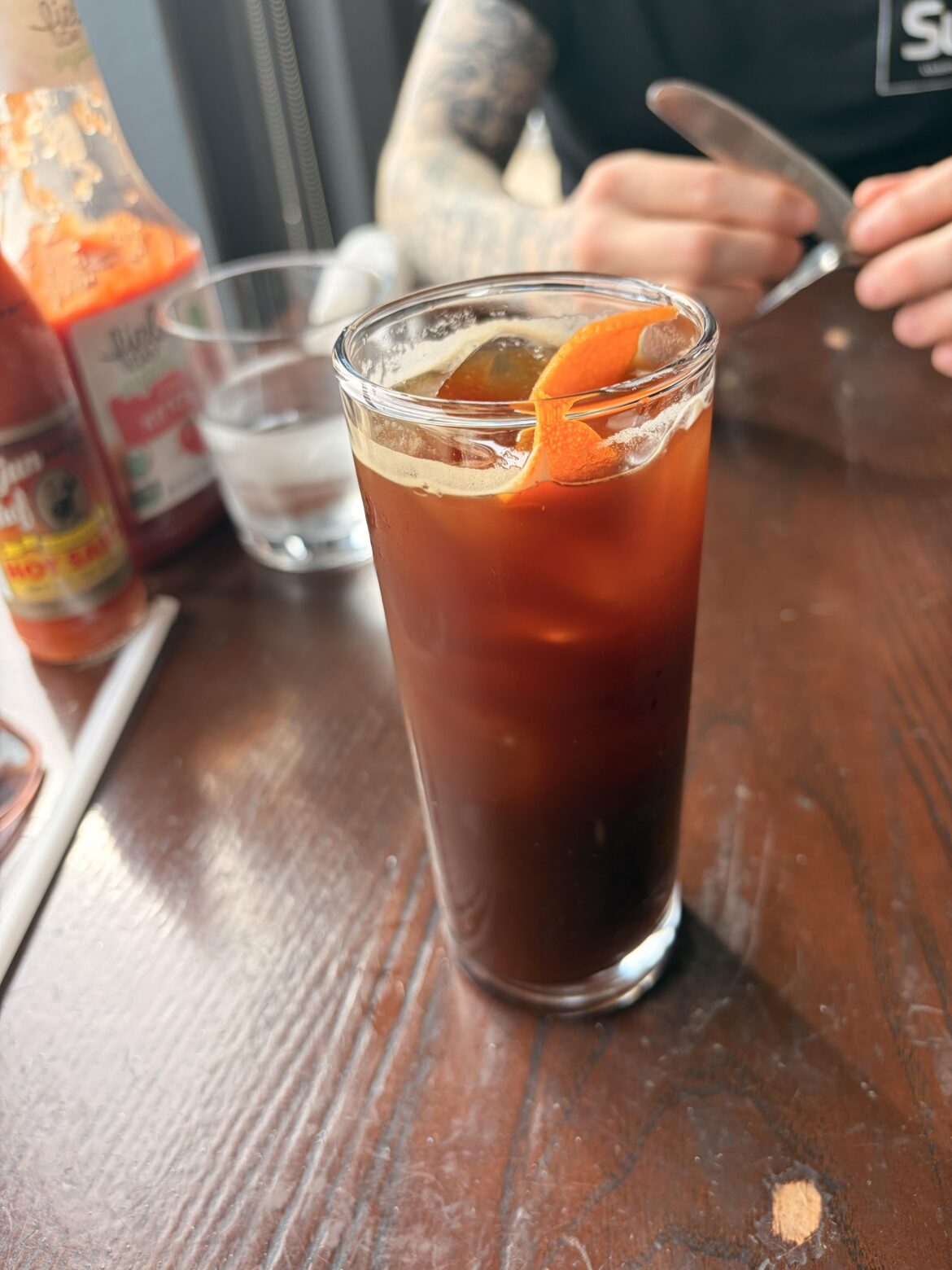 My barista put an orange peel in my Americano — why is this so good? Anyone else tried this? 🍊