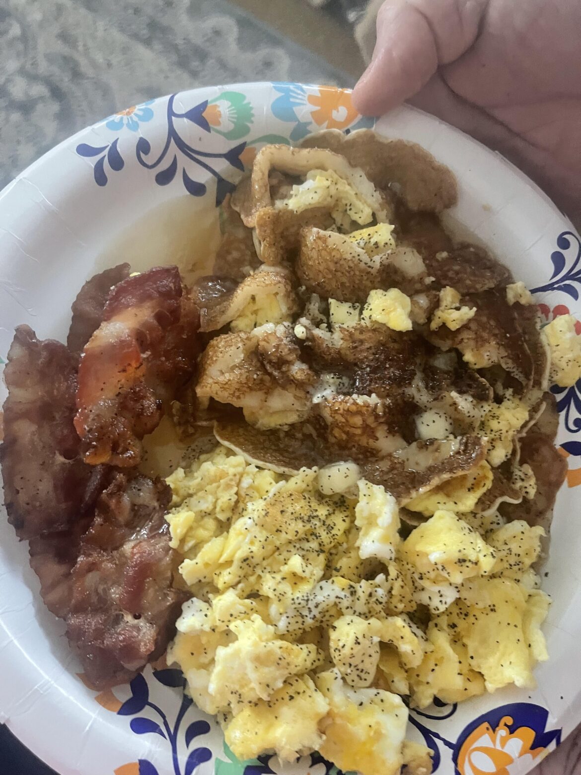 Eggs scrambled, bacon and pancakes