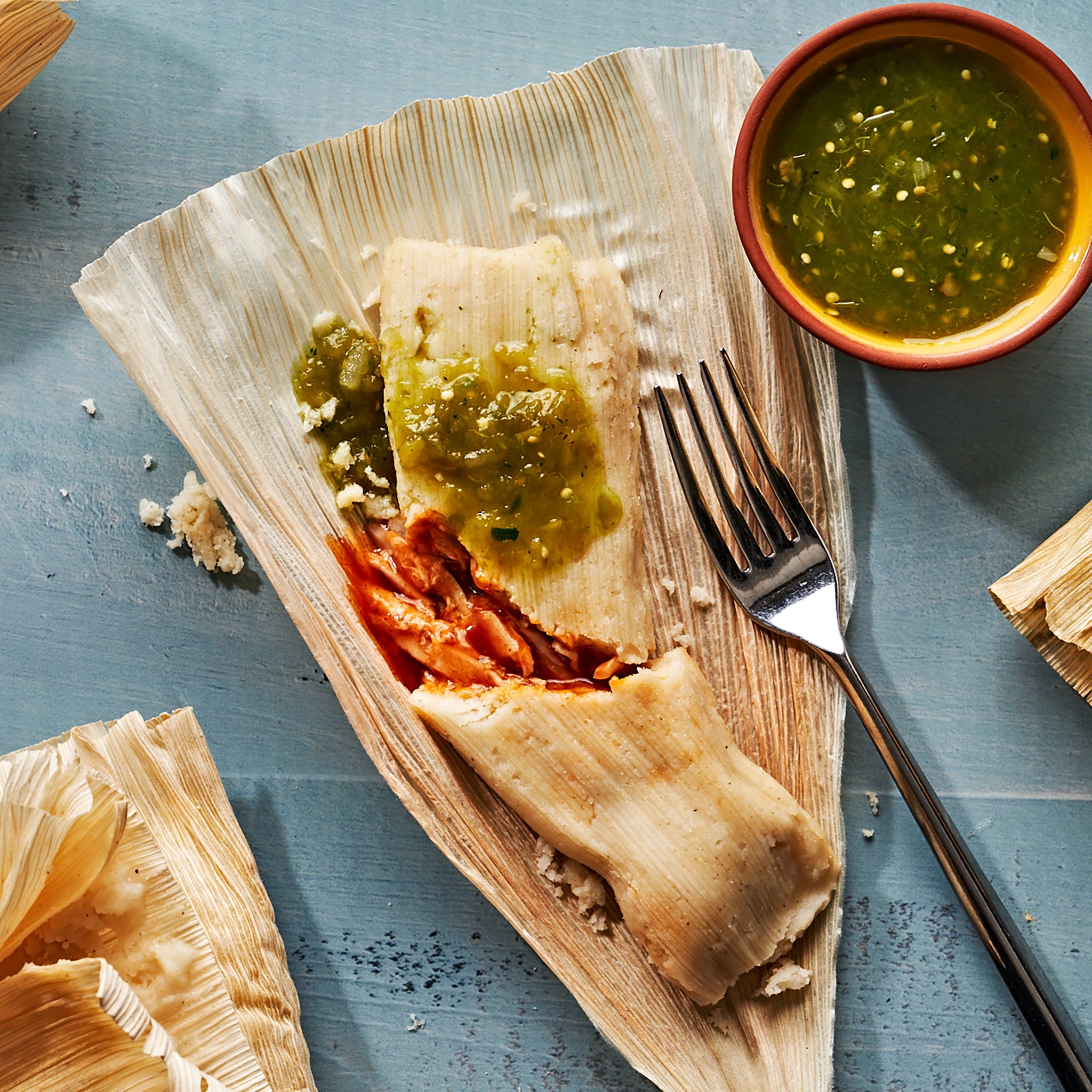 tamales served with salsa verde