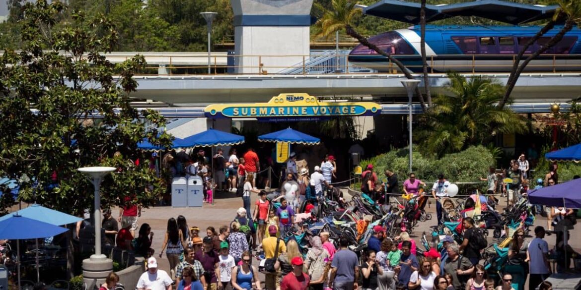 Guests gather outside the entrance of Disneyland Park's Finding Nemo Submarine Voyage ride in Tomorrowland