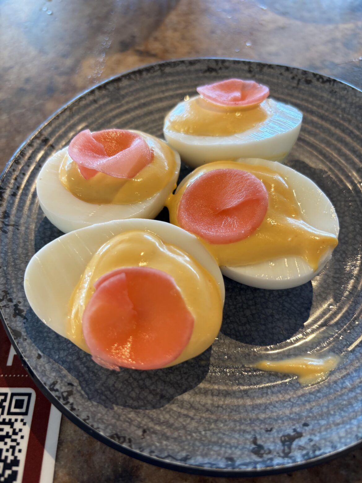 My $12 deviled eggs at the airport wine bar