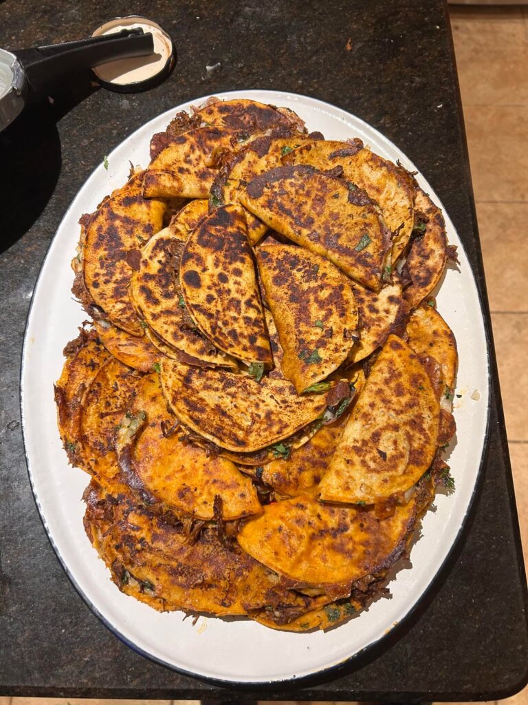 60 homemade Birria tacos for the game