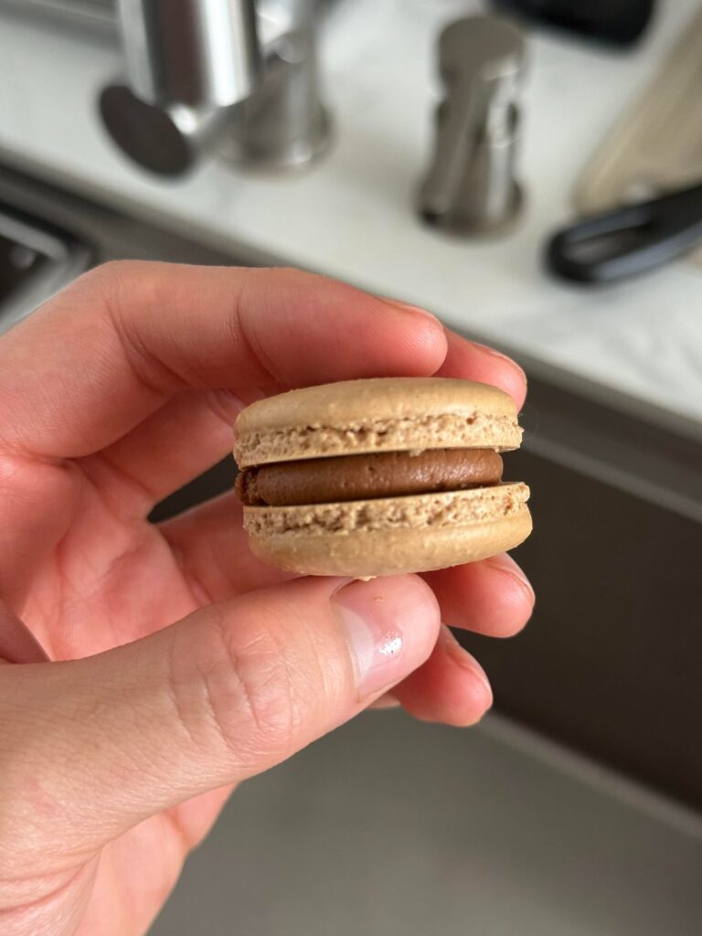 Freestyle’d some cocoa-coffee macarons but would like more volume (upwards). Any suggestions? (Weird lumps on shell is because I got lazy to double-sift the sugar)