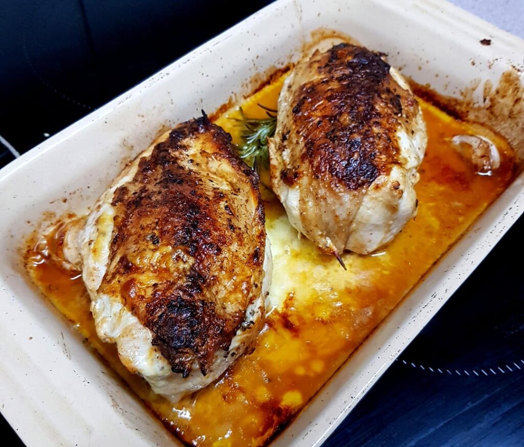 Skin-on Chicken Breasts Stuffed with Apple, Sage and Cheese, Potato Gratin and Brocolli. Topped with Crispy Smoked Bacon.