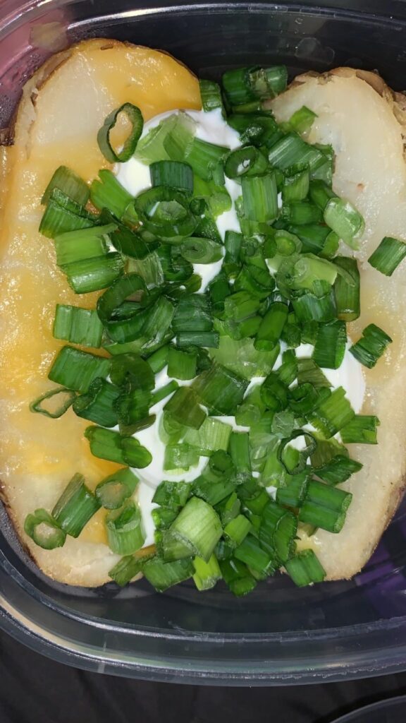 baked potato topped with green onions