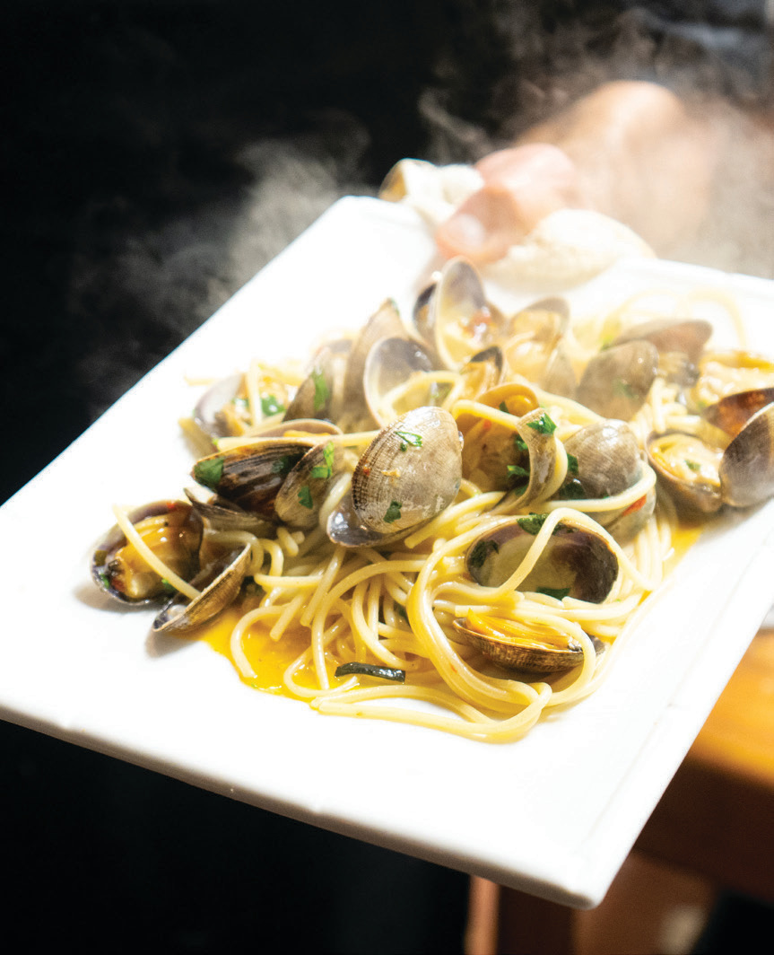 Spaghetti alle vongole with baby clams, EVOO, parsley, and pepperoncini.