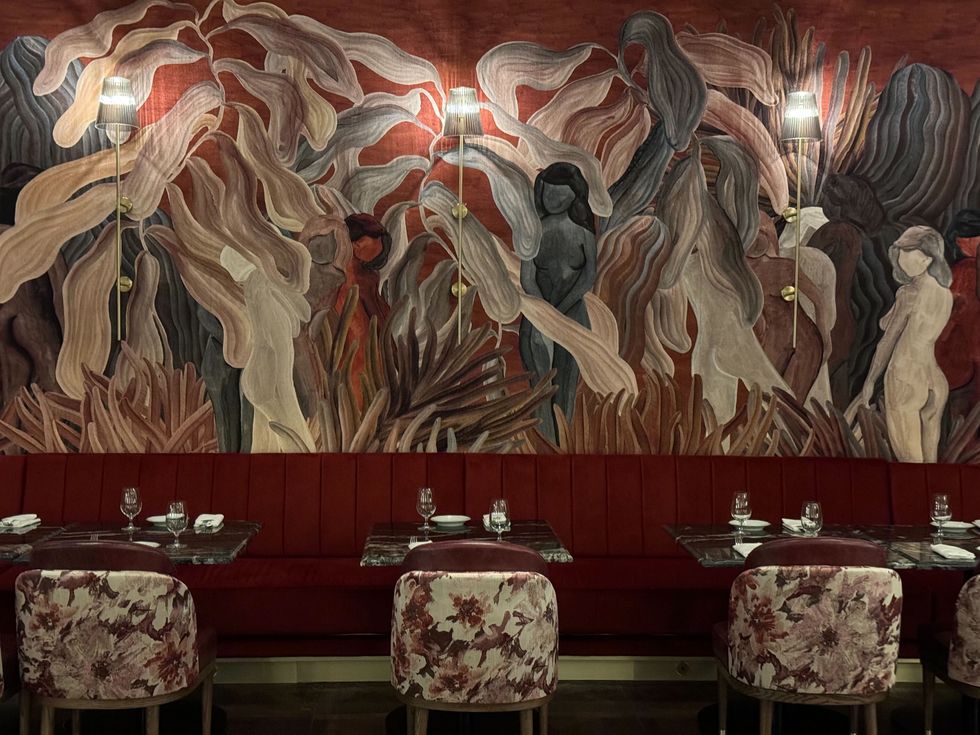 Wall art and floral chairs at a Toronto restaruant.