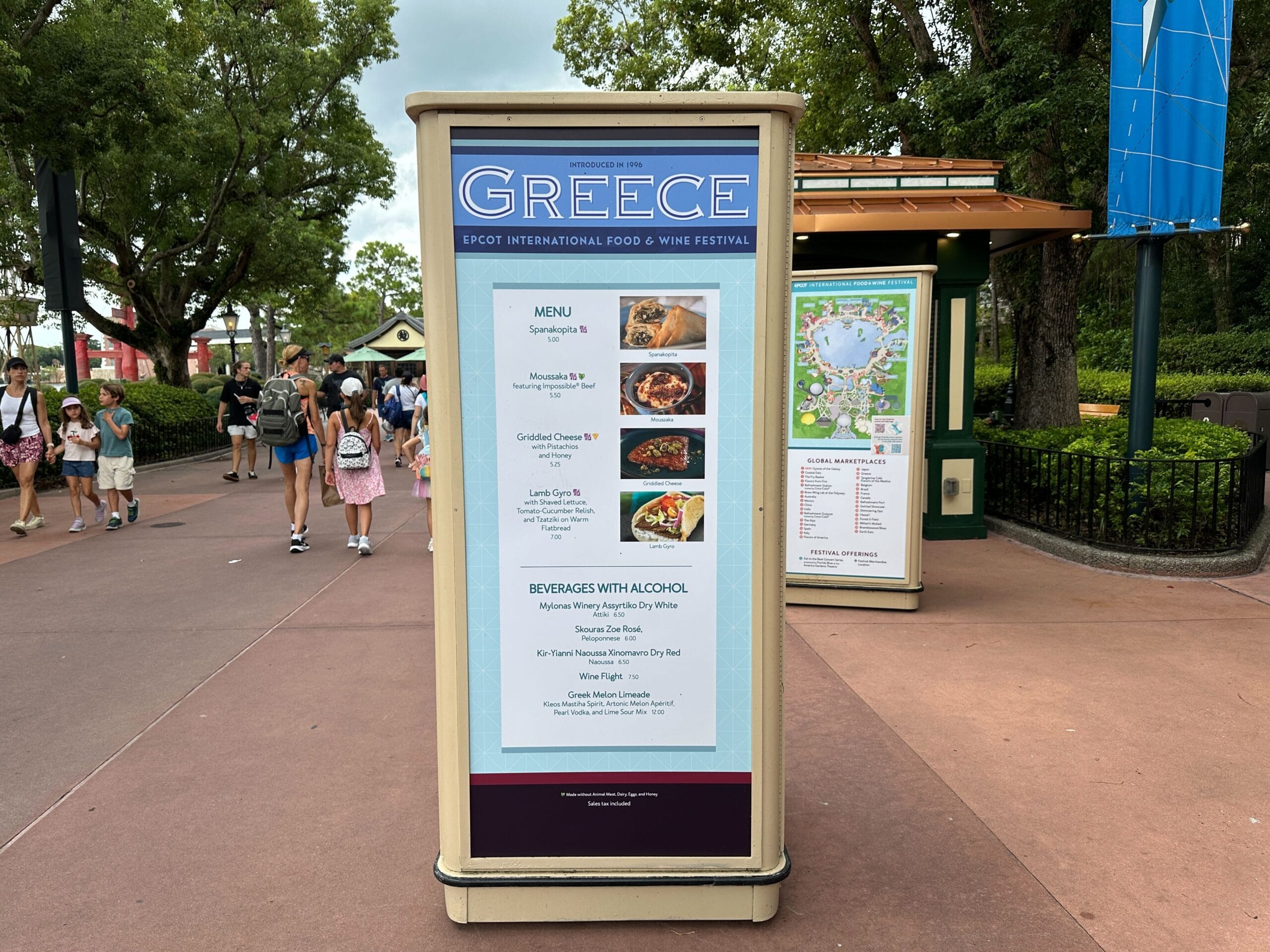 Menu board for the 2025 EPCOT Food & Wine Festival’s Greece booth, listing outdoor food and drink selections.