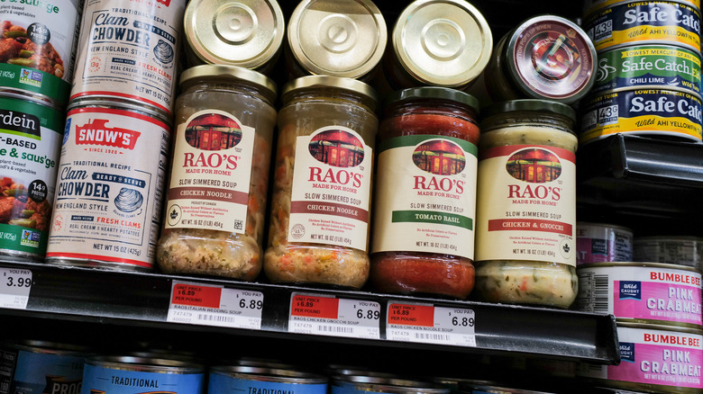Jars of Rao's soup on a grocery store shelf.