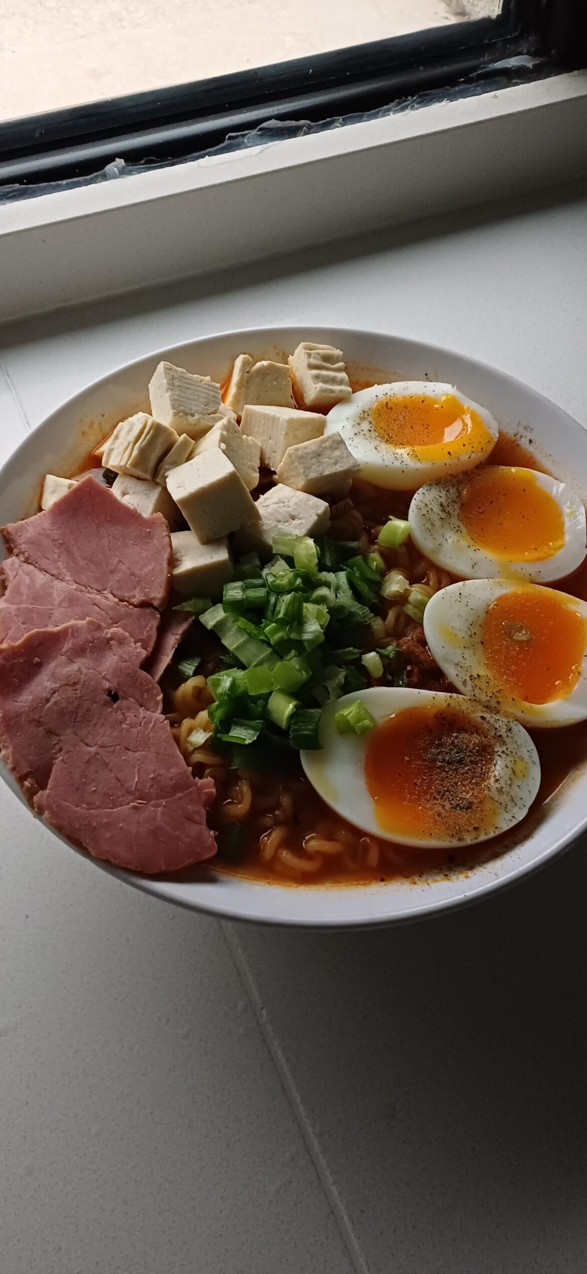 Made spicy ramen with tofu, eggs, and beef slices. It was delicious
