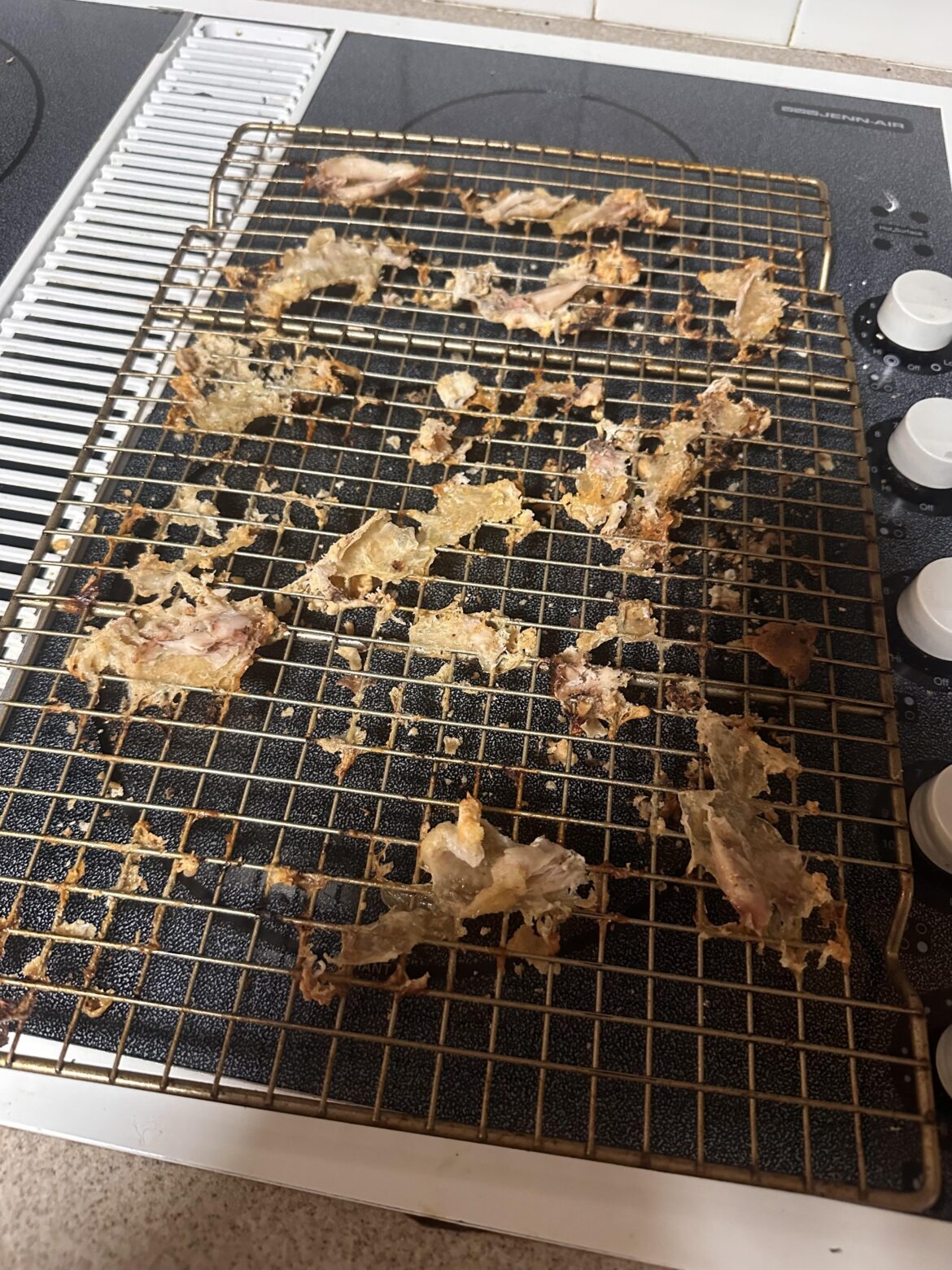What am I doing wrong? Skin sticks to rack despite cooking spray.
