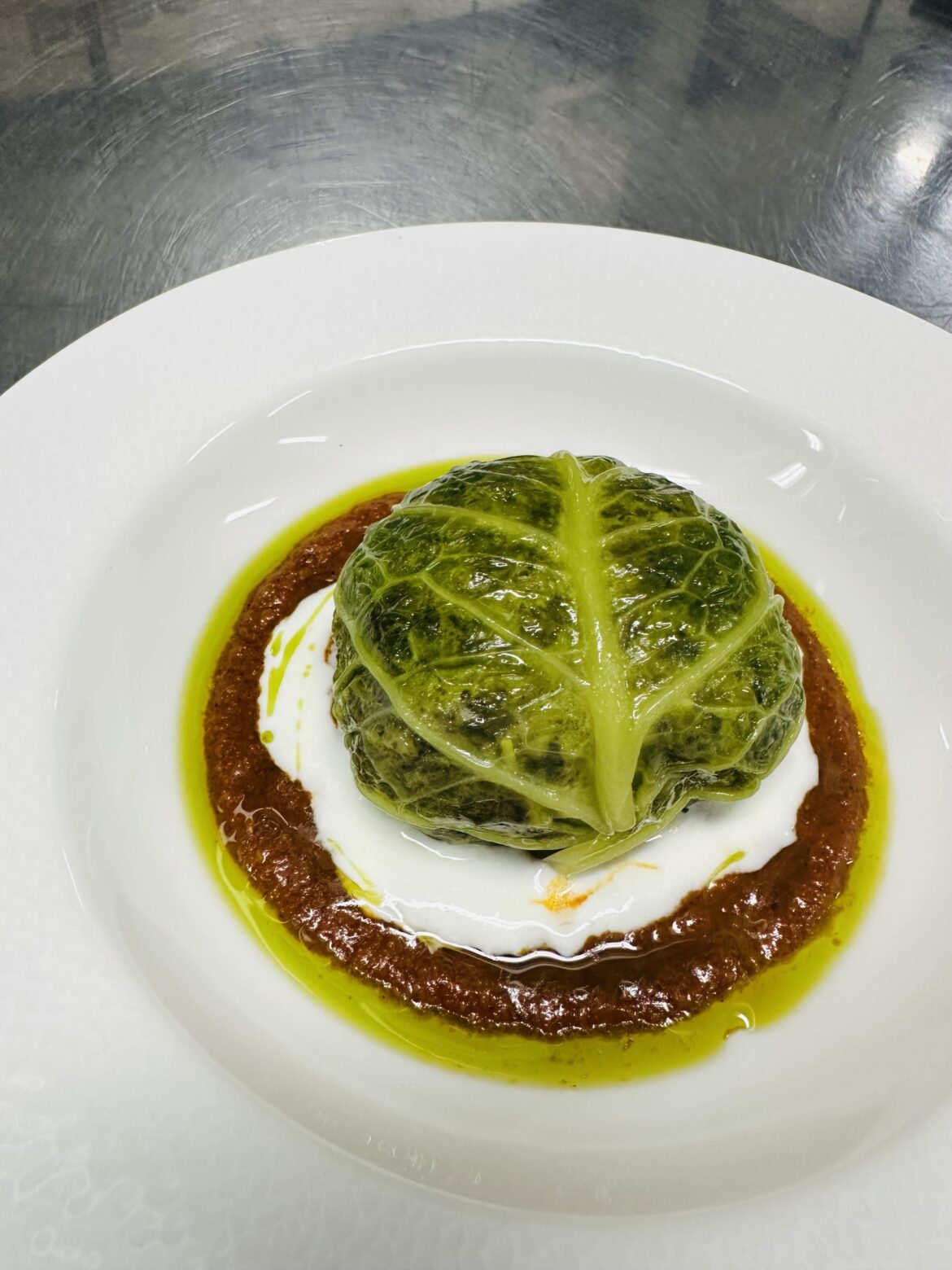 Mushroom and Arborio Stuffed Cabbage Parcel, with Harissa, and Yogurt.