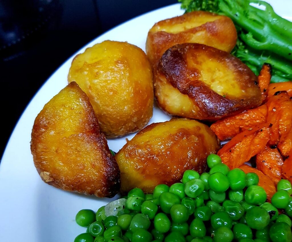 This Week's Roast - Pork Shoulder and Crackling, Roast Potatoes, Stuffing in Bacon, Sweet Carrots, Sautéed Broccoli and Buttery Peas. Cider Shallot Gravy.