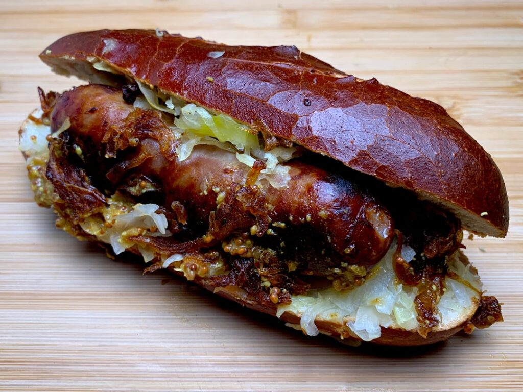 Laugenstangen with Bratwurst, sauerkraut, crispy onions and mustard