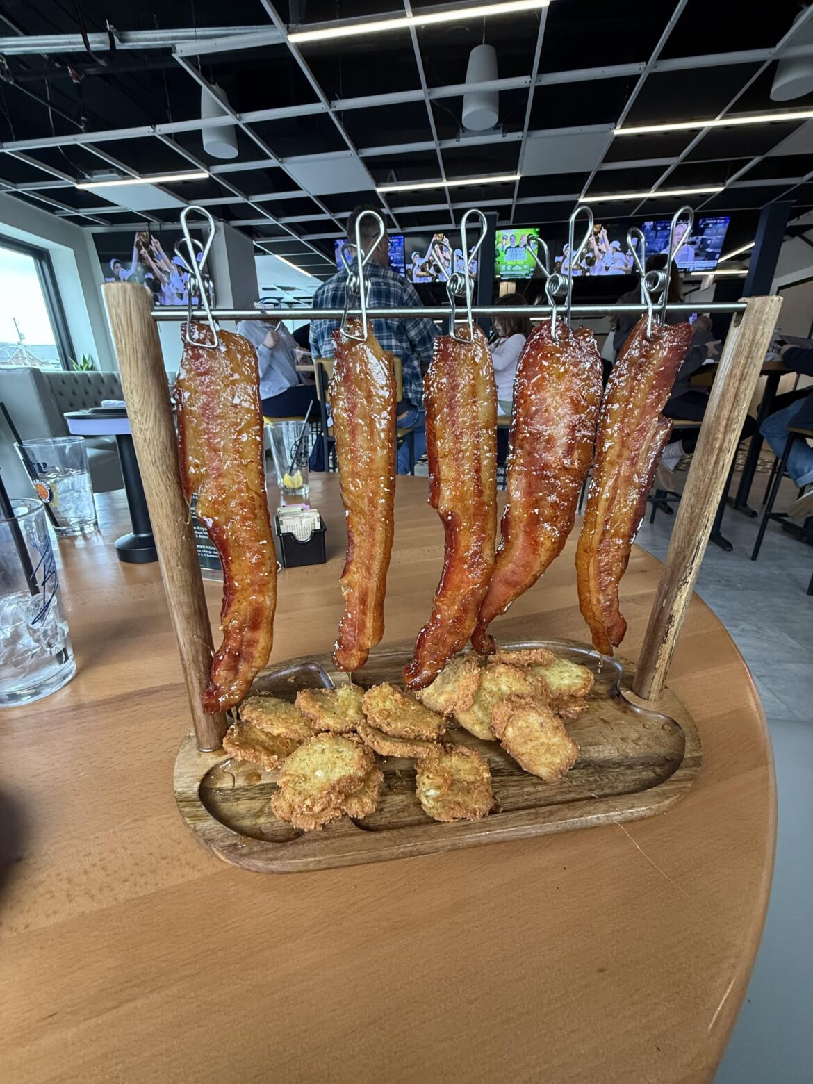 Bacon served as meat curtains over hash brown discs