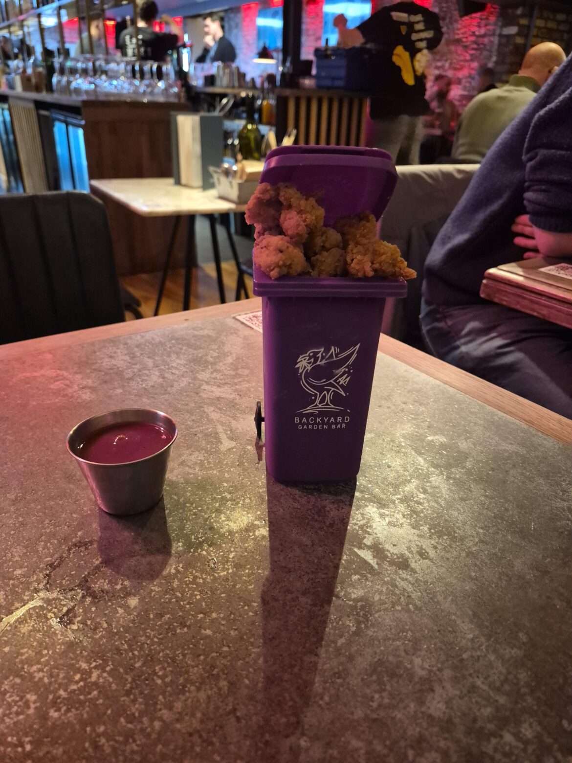 Popcorn chicken served in a bin