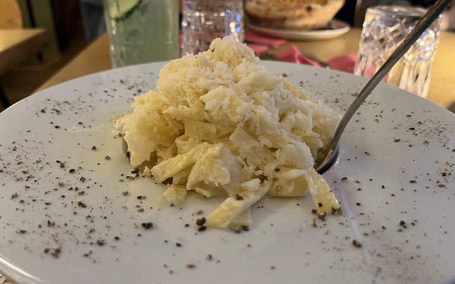 Pomodorino's cacio and pepe is served piping hot off the wheel, slathered in delicious, melty Parmesan cheese.