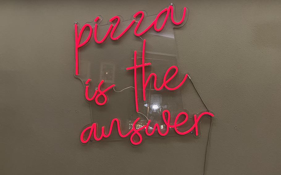 Pomodorino has two mottos, "make pizza, not war," and "pizza is the answer," which are prominently displayed around the Weiden hot spot.