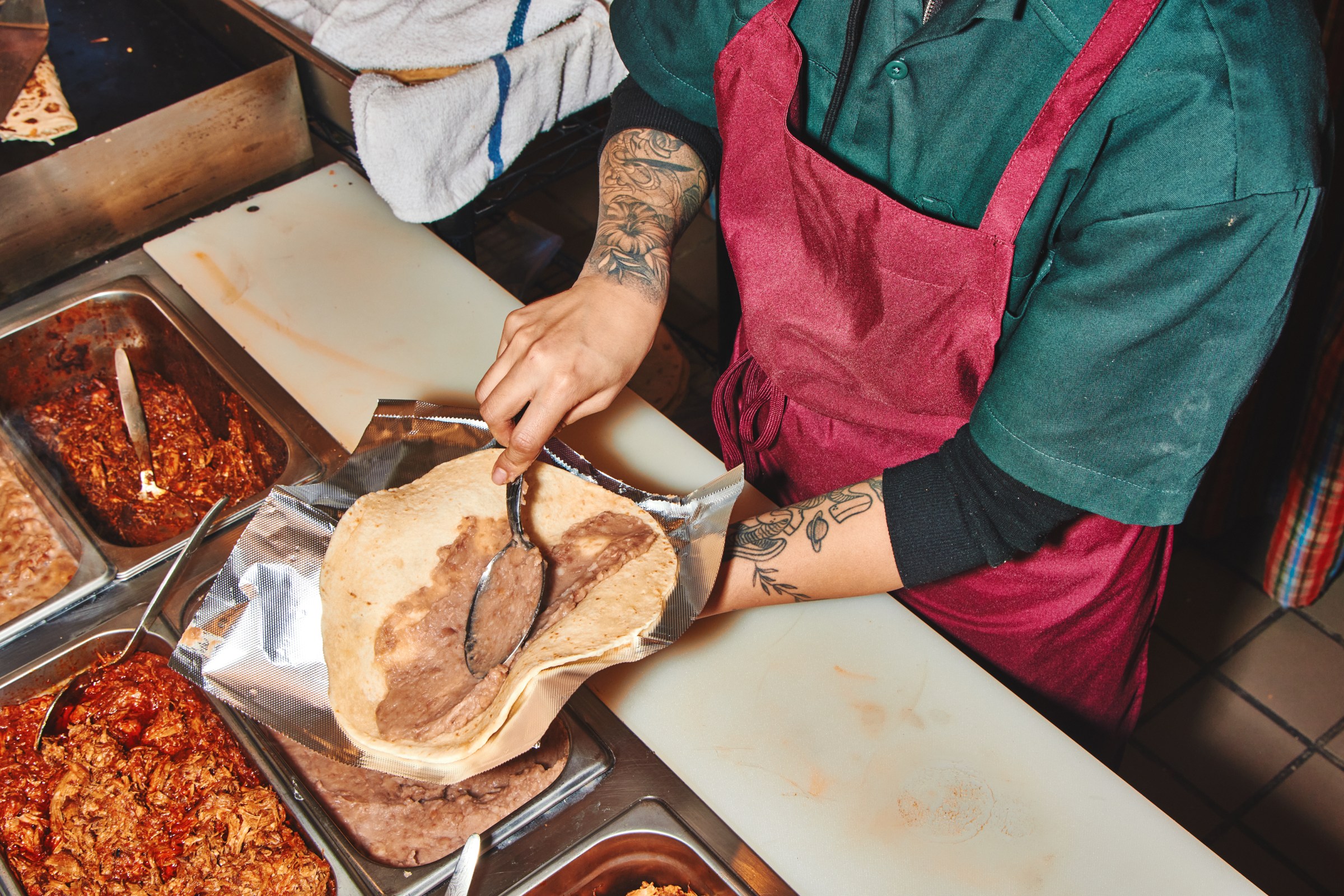 Making burritos at Los Burritos Juarez.