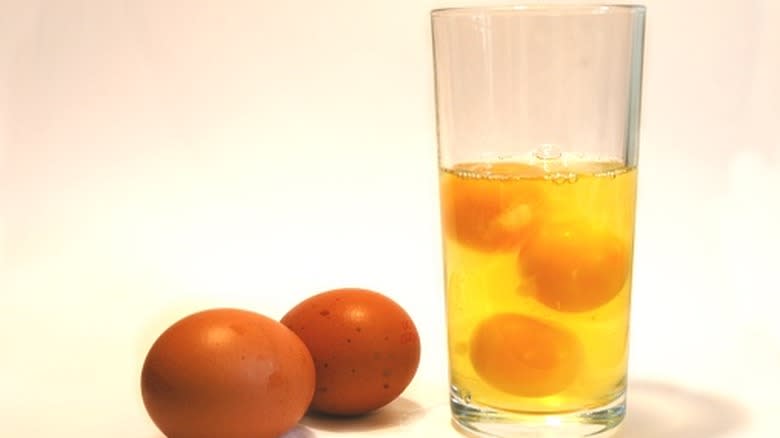 A glass full of raw eggs.