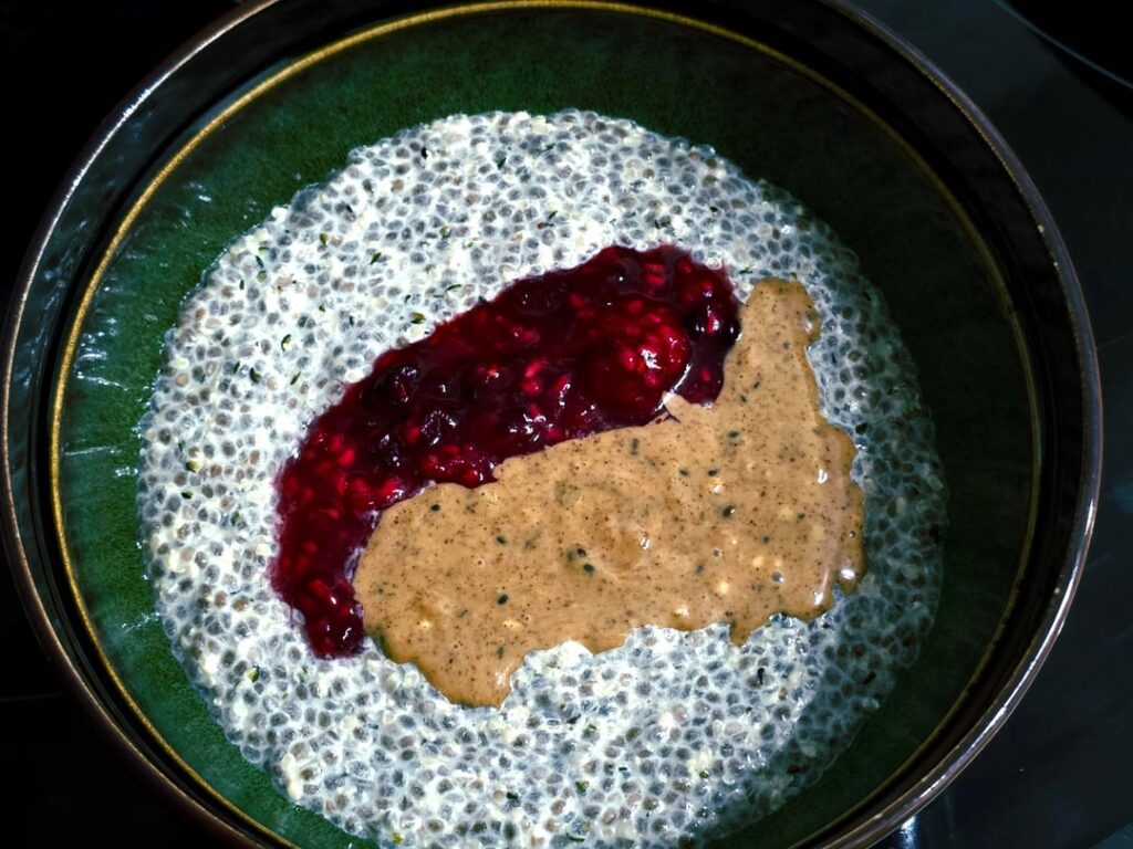 First time trying hemp hearts and chia seed pudding. Mixed nut butter and homemade raspberry spread.