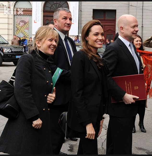 Jolie and Helic (left) grew close in 2012 after she teamed up with his then-boss, former UK foreign secretary William Hague (right), on an anti–sexual violence campaign