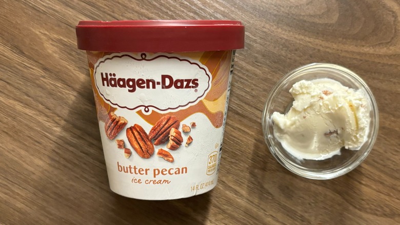 Häagen-Dazs Butter Pecan Ice Cream carton next to ice cream in glass ramekin