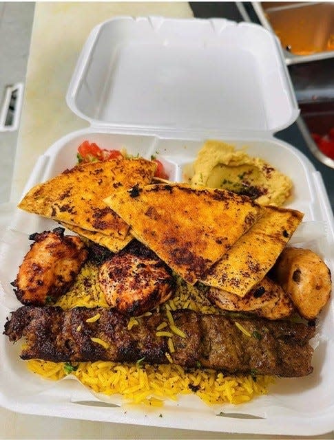 Mixed grill platter with grilled meats, rice and pita is served at Olive Flame-Mediterranean Grill in West Allis.