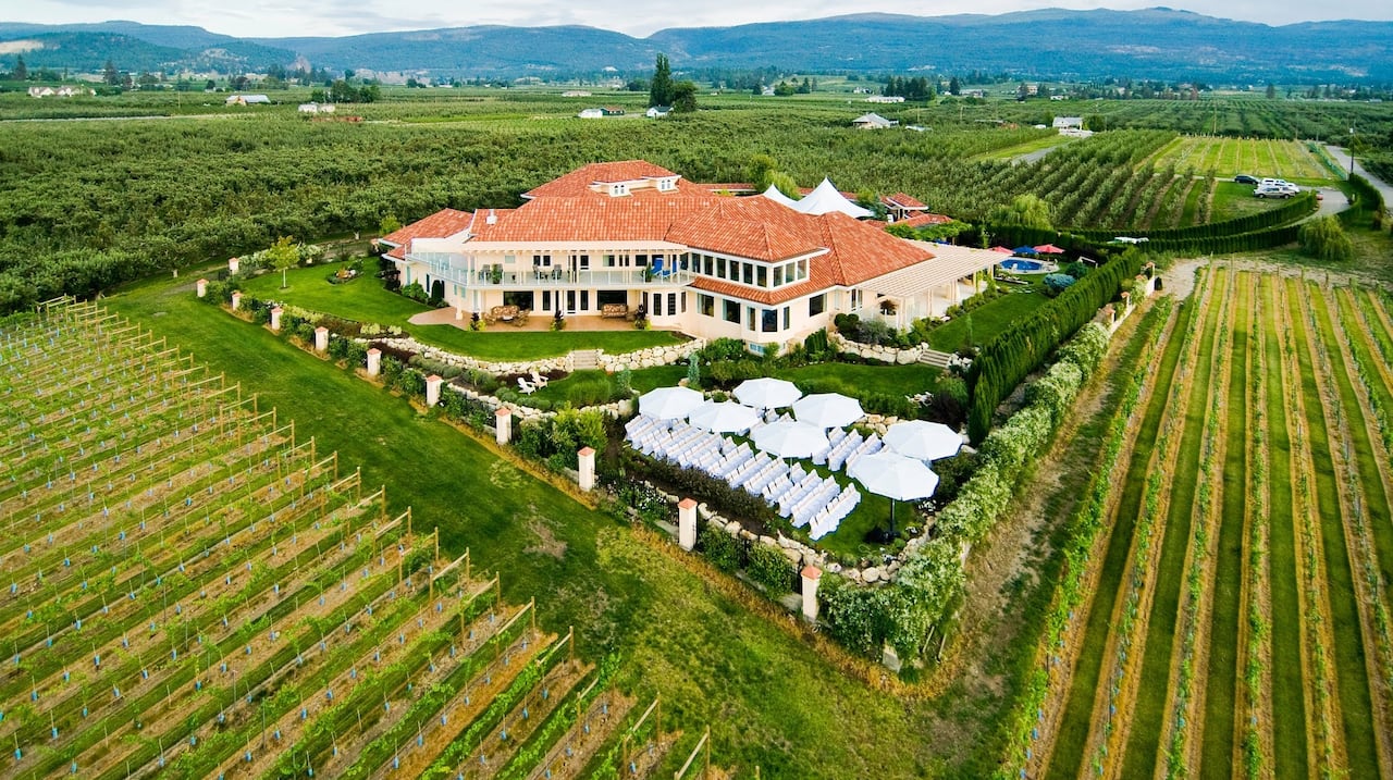 A large winery with wedding seating visible.