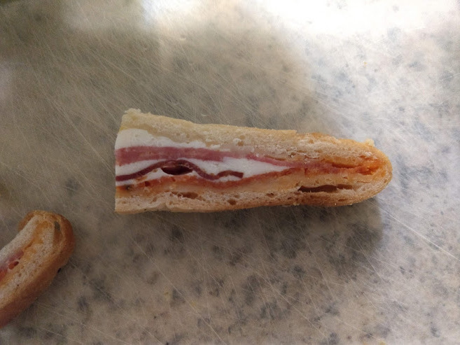 My in-laws collect Native American art from the Pacific North West. This cold slice of stromboli looks like a 1st Nations stylized bird face. It’s kind of freaky.