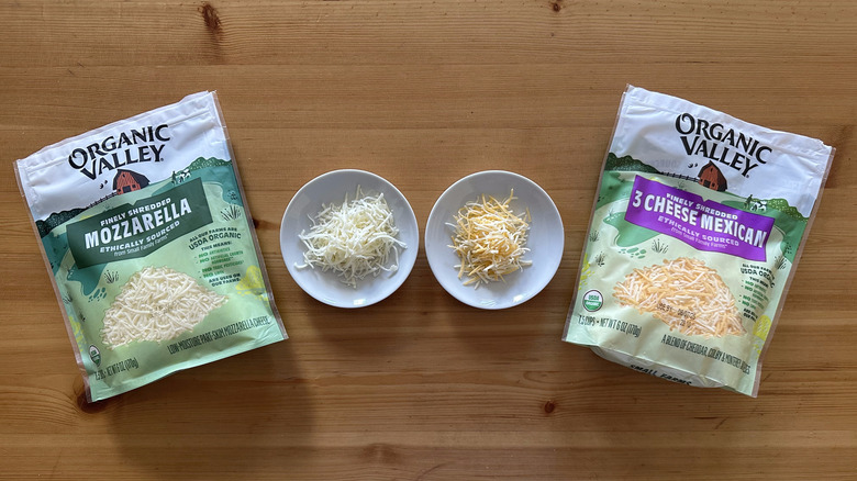 Bags of Organic Valley cheeses on wooden table