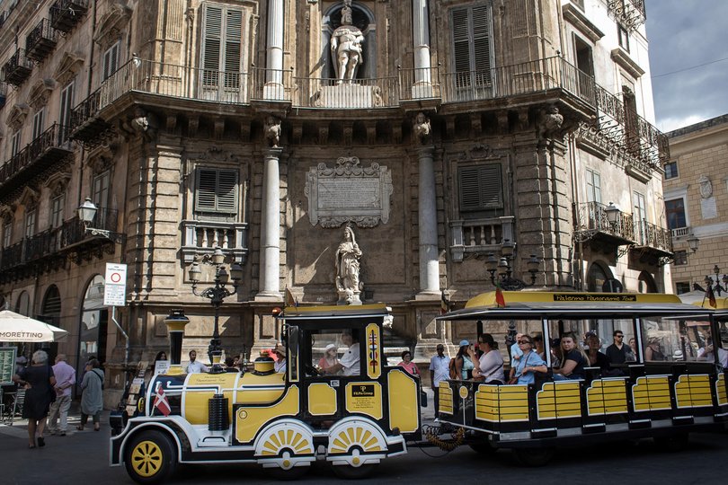 A tourist trolley visits the Quattro Canti square in Palermo, Sicily, Italy.