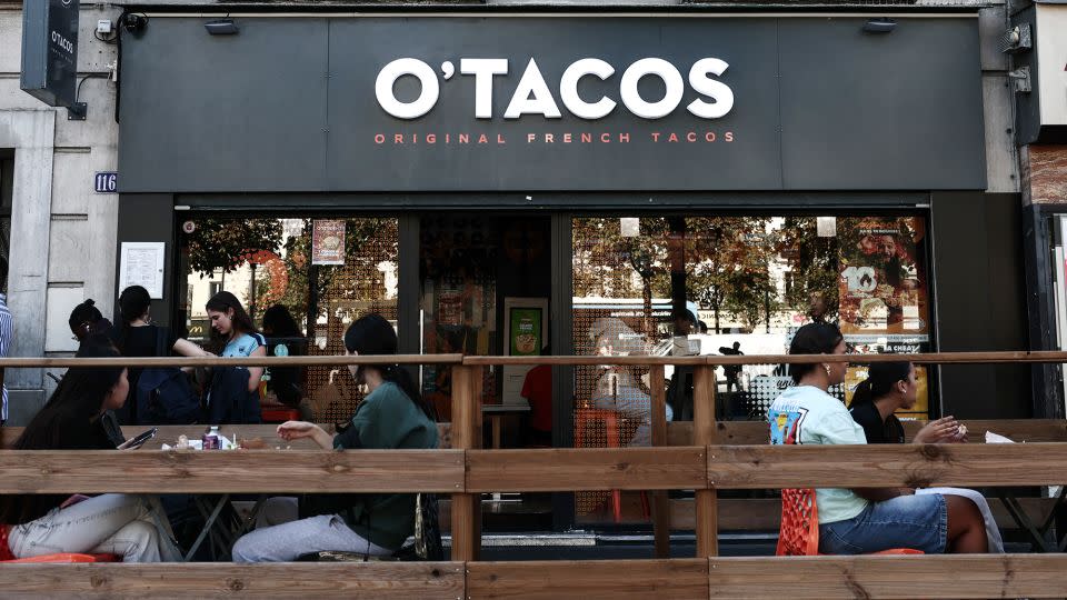 French fast food chains like O'Tacos, above, are often located close to American chains such as McDonald's. More than half of the French restaurant industry’s revenue is now generated by the fast food and fast casual market, one expert estimates. - Thibaud Moritz/AFP/Getty Images