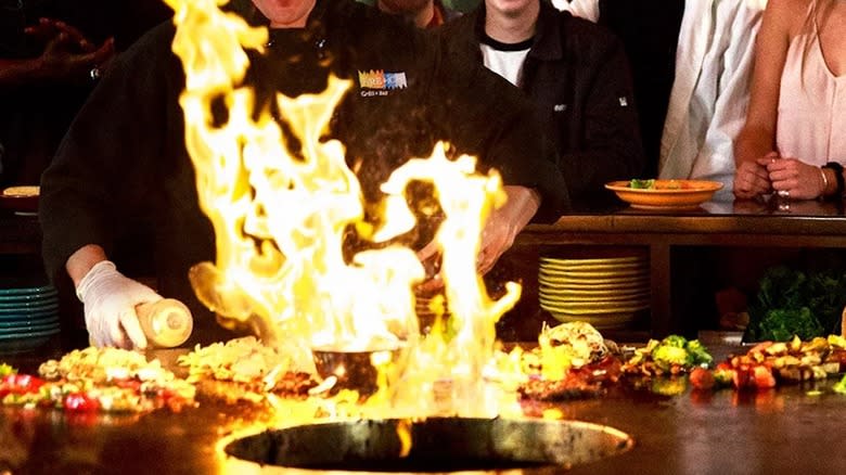 Customers fill their bowls with vegetables at FiRE+iCE