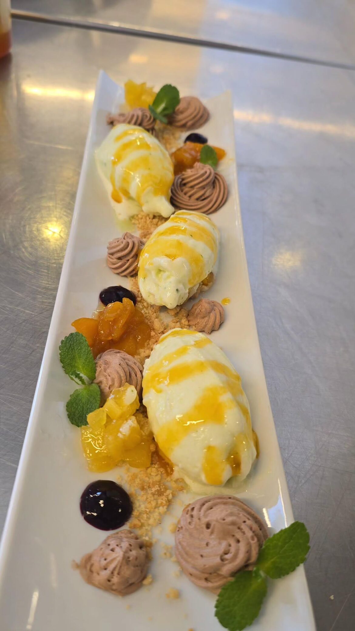 I made lemon and mint quenelles, mango coulis, and chocolate mousse