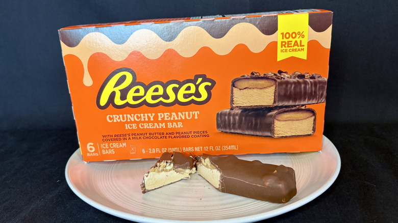 Reese's ice cream bar cut open on plate with box in background