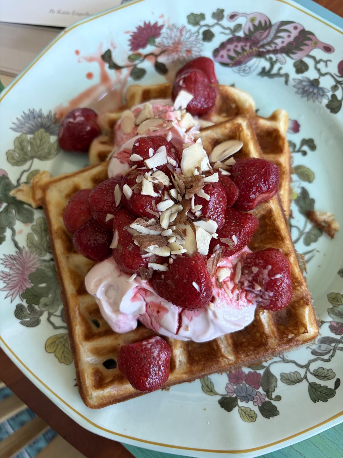 Cardamom waffles, yogurt with pomegranate molasses and the last strawberries from my freezer