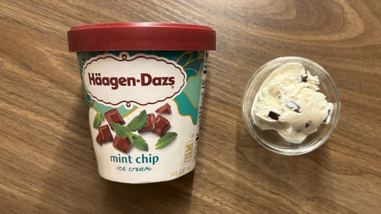 Häagen-Dazs Mint Chip Ice Cream carton next to ice cream in glass ramekin