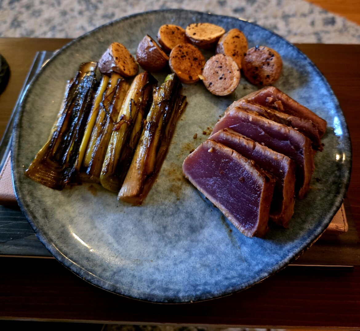 Seared miso soy tuna, braised sesame leeks, potatoes.