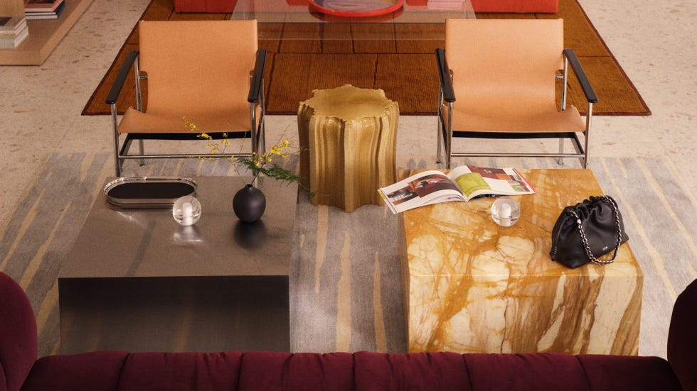 Modern living room setting with chairs and tables.