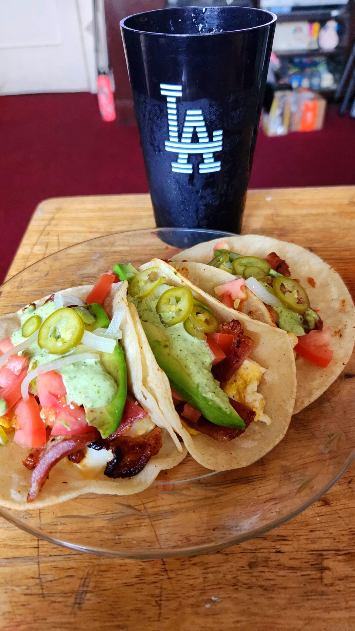 Breakfast tacos with green aji sauce and pickled serranos