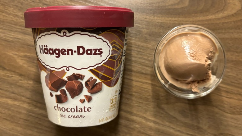 Häagen-Dazs Chocolate Ice Cream carton next to ice cream in glass ramekin