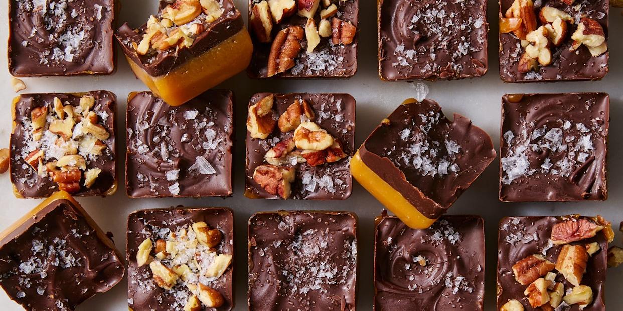 chewy toffee bites topped with flaky sea salt and chopped pecans