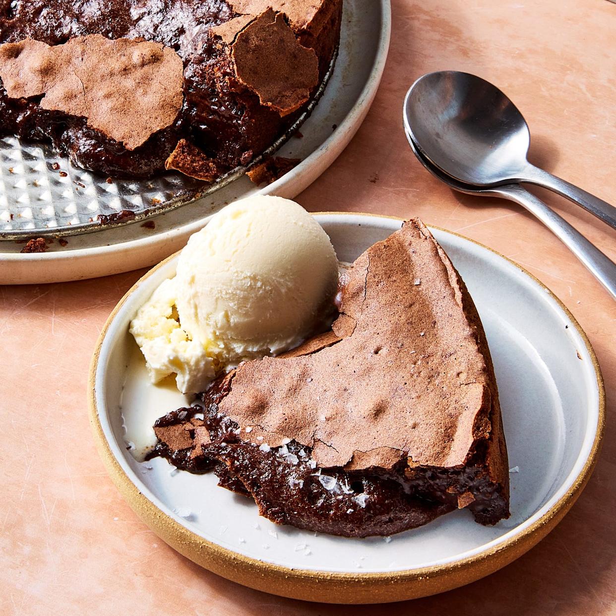 large chocolate lava cake topped with vanilla ice cream