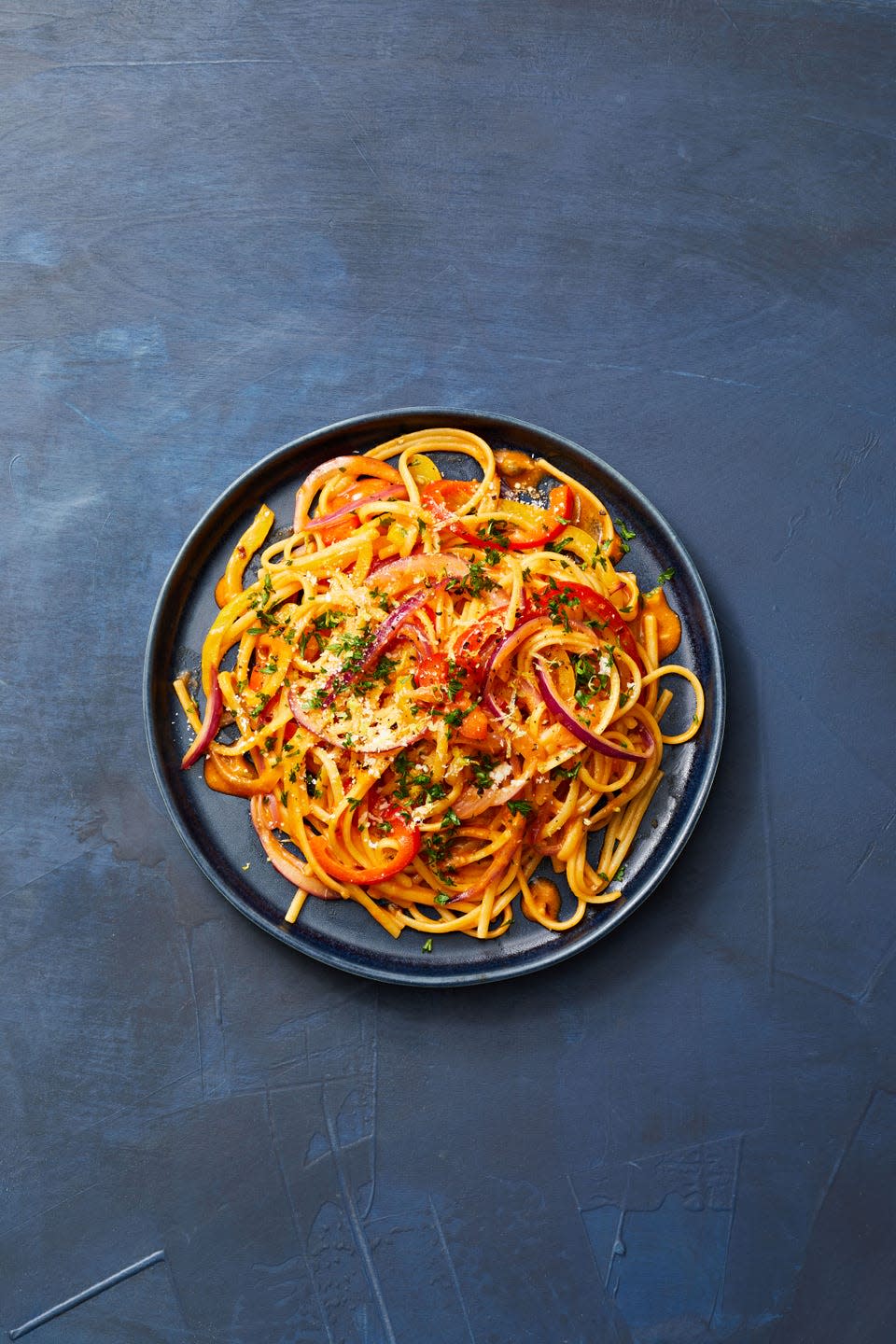 plate of linguine with red sauce and vegetables