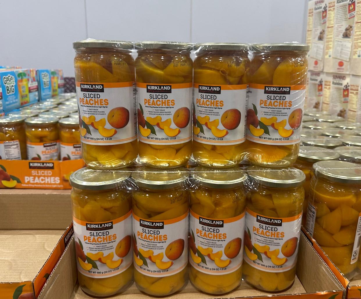 Jars of Kirkland Signature sliced peaches in Costco