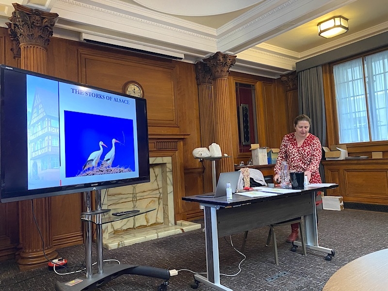 Laura Kent Teaches A French Wine Class In Leeds Using A Slide About The Storks Of Alsace From Wine Scholar Guild