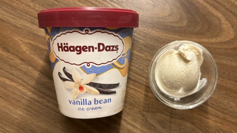 Häagen-Dazs Vanilla Bean Ice Cream carton next to ice cream in glass ramekin