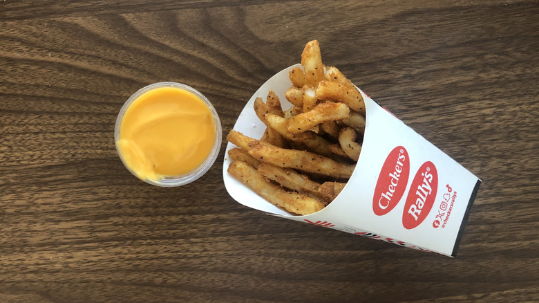 Order of Rally's famous seasoned fries with cheese sauce.