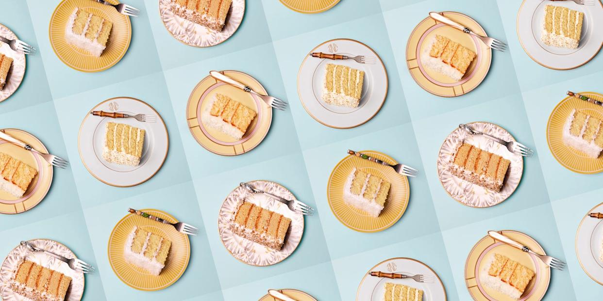 Several plates of layered cake arranged in a pattern.